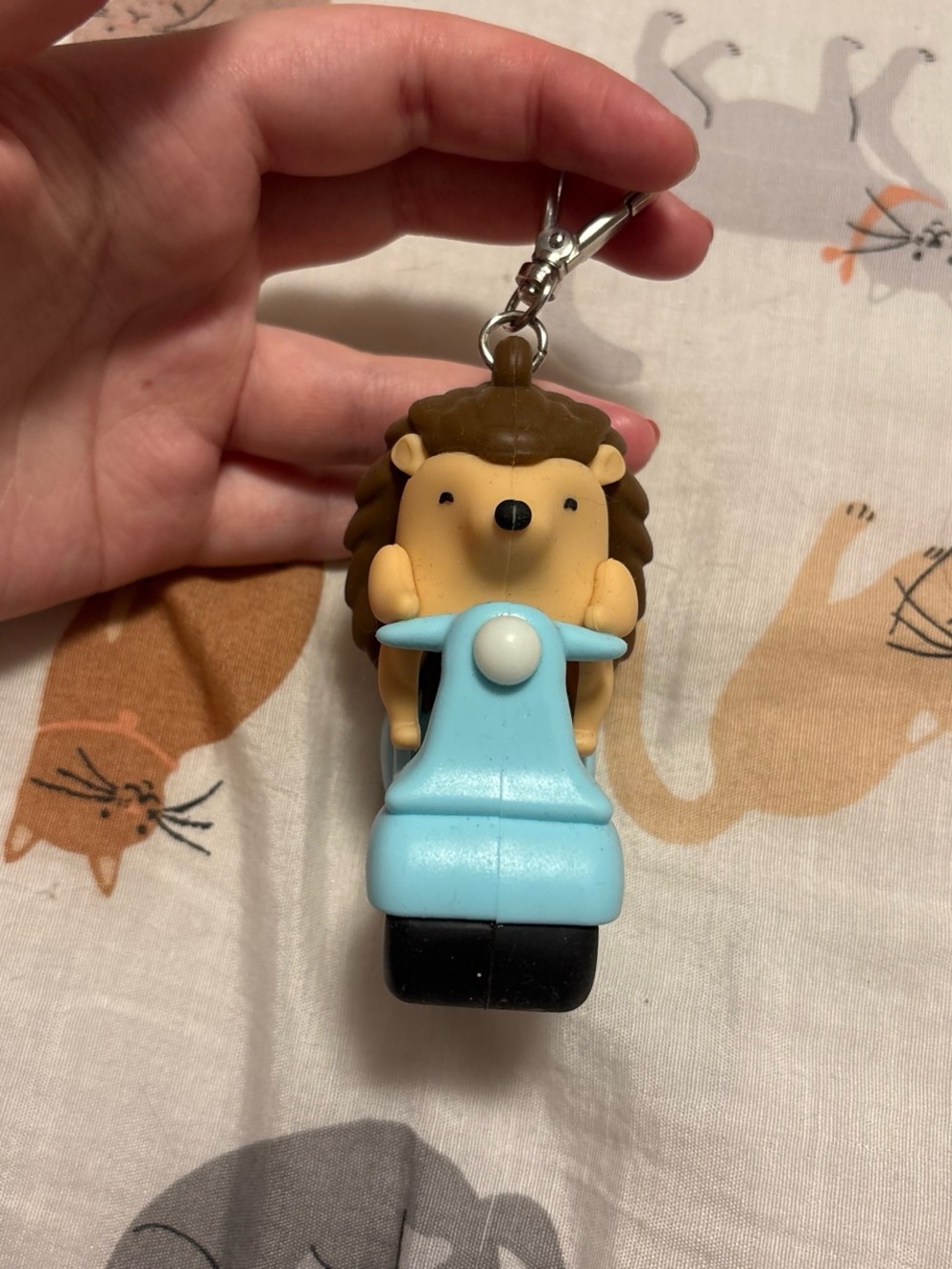 hedgehog on scooter bath and body works hand sanitizer holder keychain